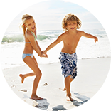 kids running on the beach