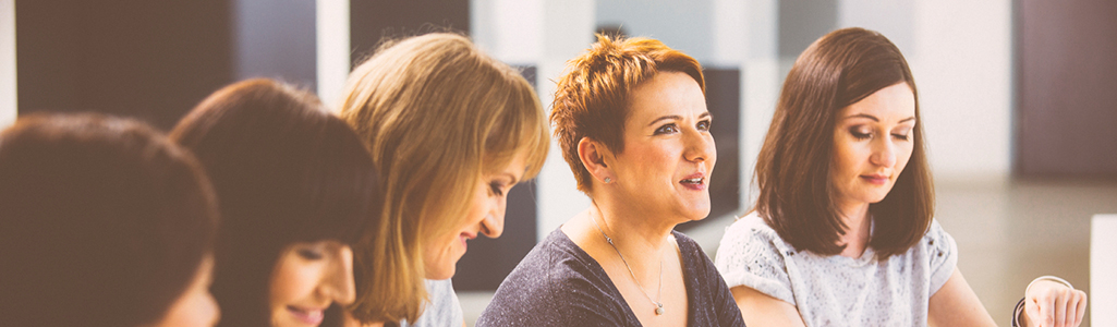 Women in a seminar talking